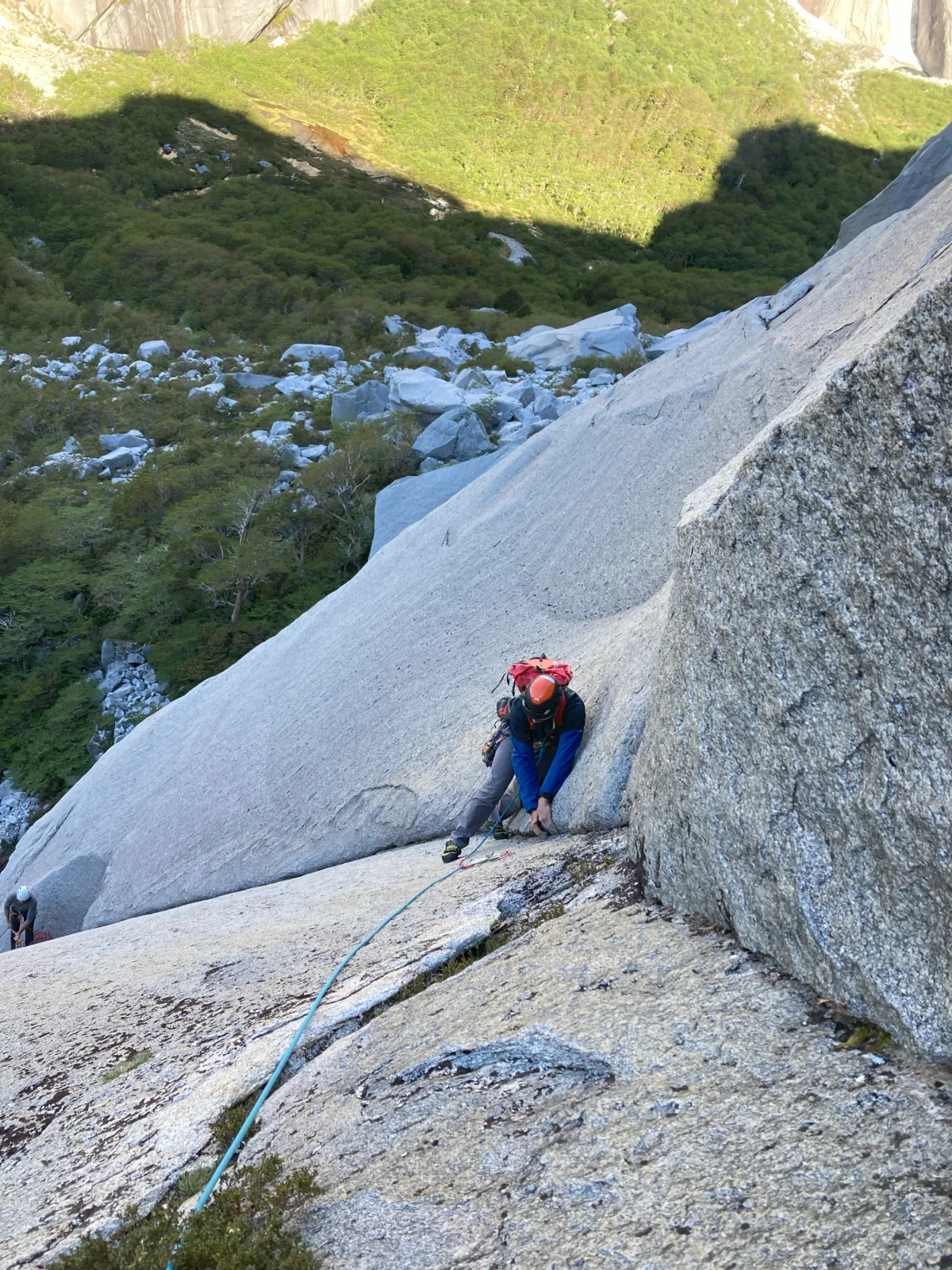 Roped climber in a long granite corner.
