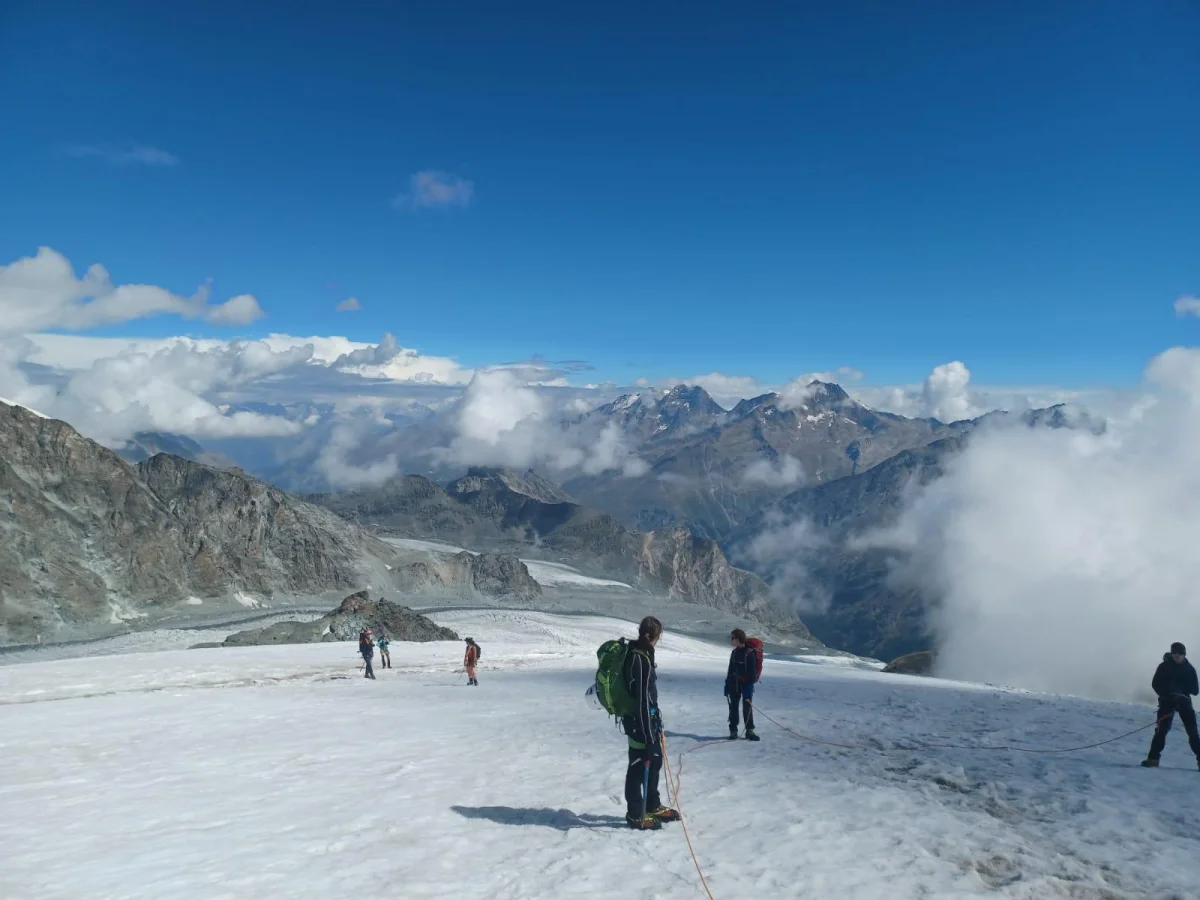 Beginner-Friendly Glacier and Mountaineering Course: Mountaineering group on a sunlit glacier.