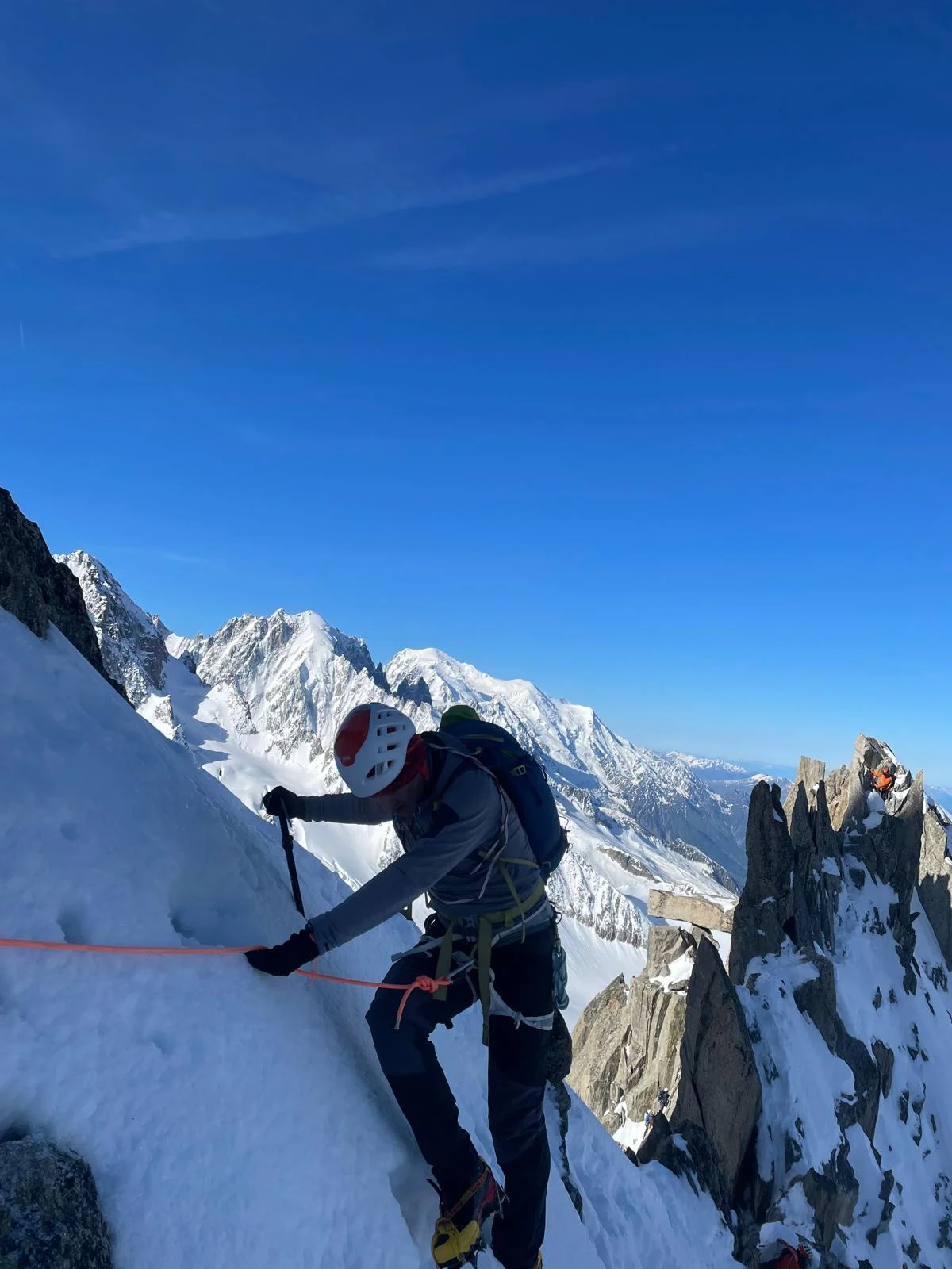 Arête de la Table on Aiguille du Tour: Mountaineer crossing a snow-covered rock section.