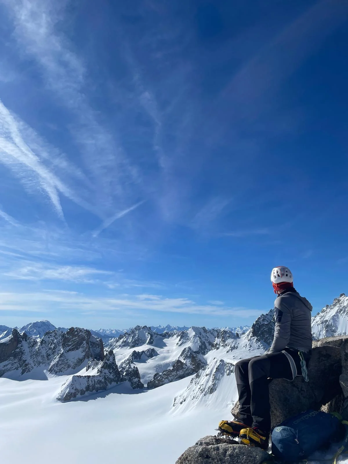 Arête de la Table on Aiguille du Tour: Mountaineer on a rocky summit above a broad glacier.