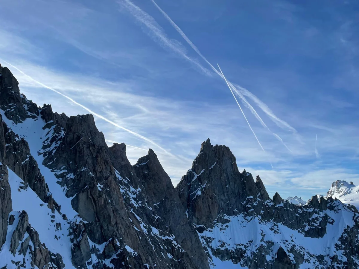 Arête de la Table on Aiguille du Tour: Jagged rocky ridge with snowfields in morning light.