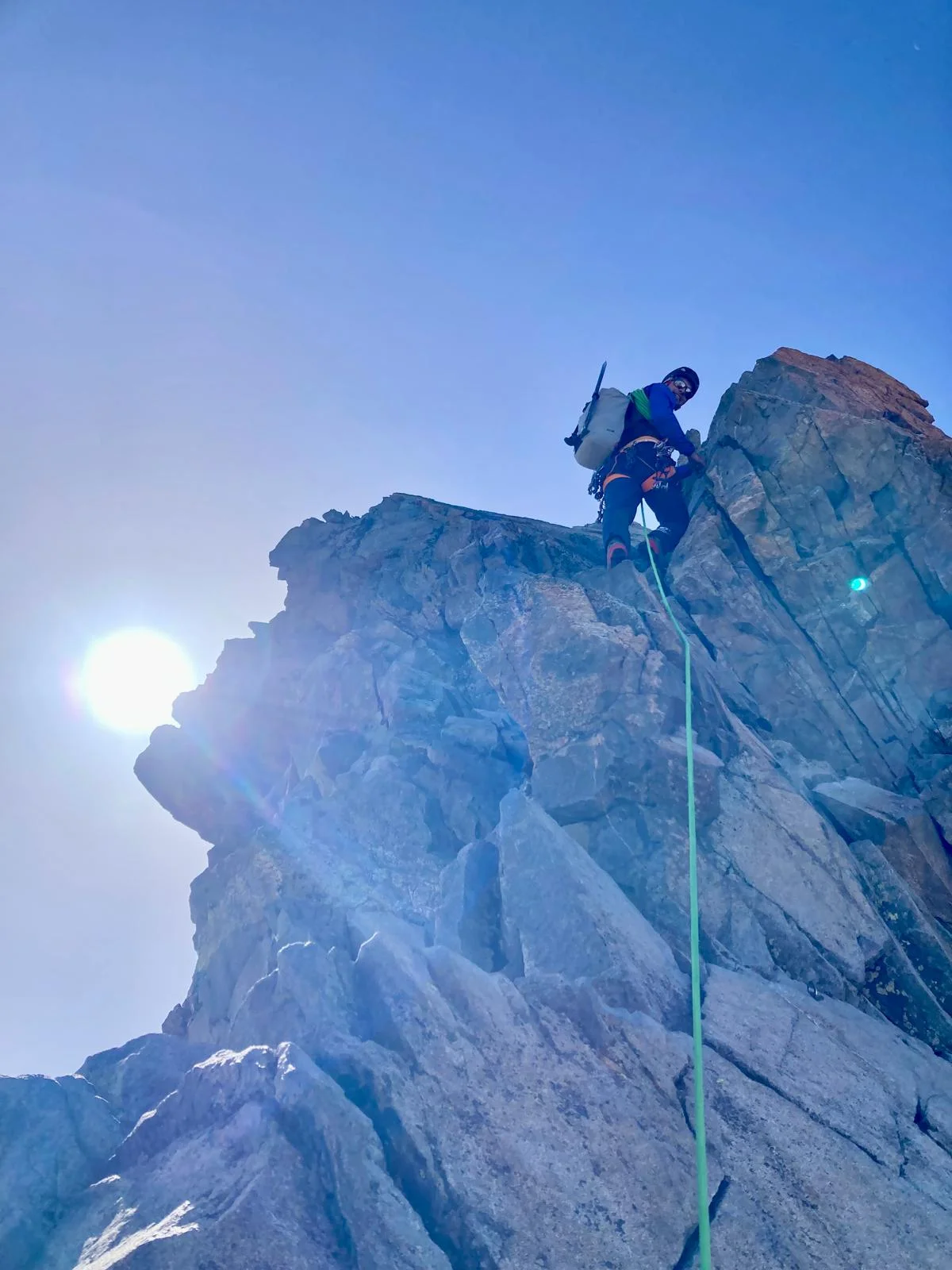 Biancograt on Piz Bernina: Roped mountaineer on a steep snow ridge.