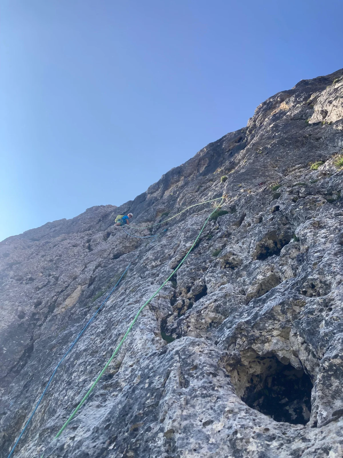 Burgstallkante – Dolomite Classic with Mountain Guide: Safety ropes on a grey rock wall.