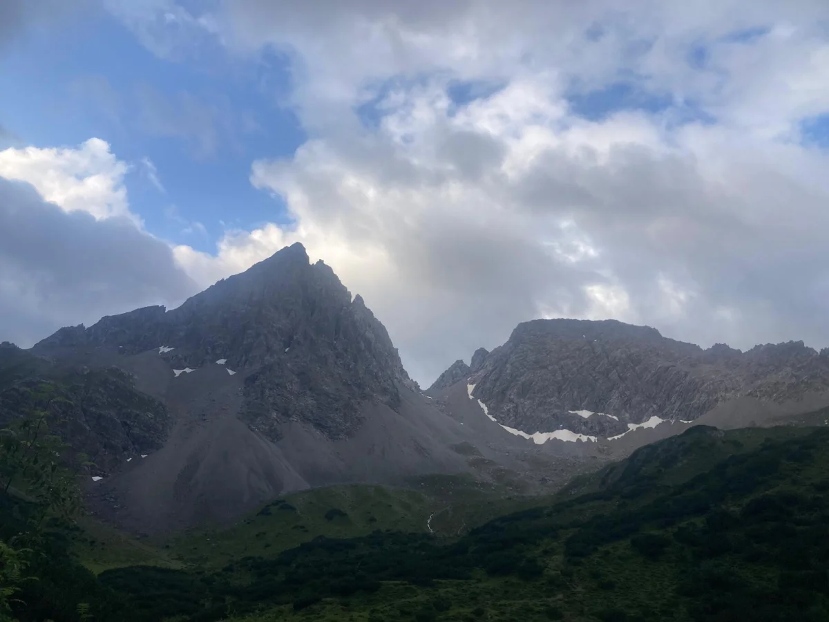 Dremelspitze – One of the Most Beautiful Peaks in the Lech Valley: Rocky mountain peak above a green valley.