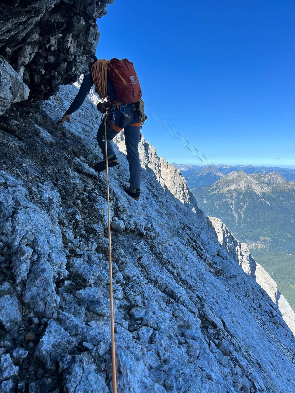 Eisenzeit – Zugspitze North Face: Roped climber below a rock overhang.