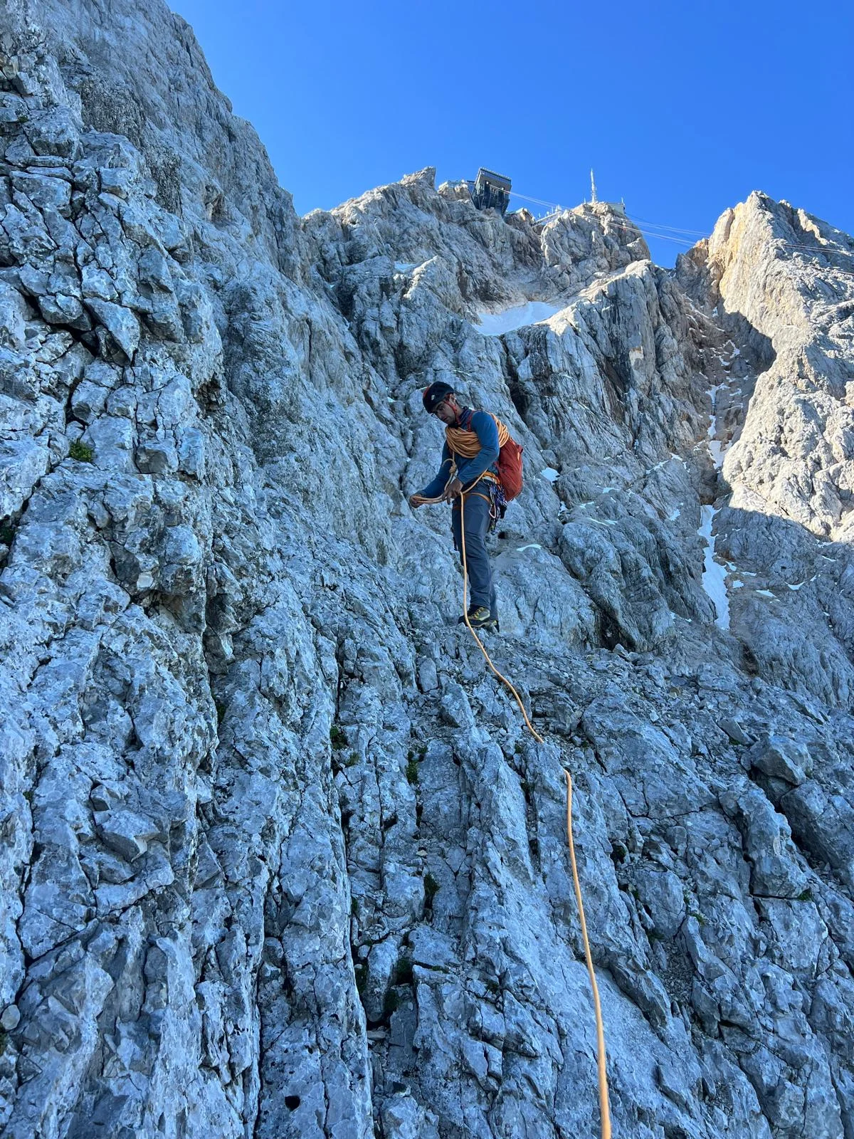 Eisenzeit – Zugspitze North Face: Climber on the final rock steps before the ridge.