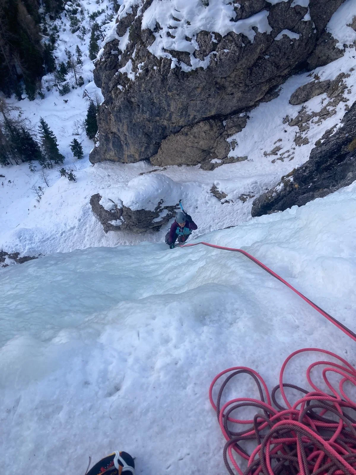 Ice Climbing in Colfosco with a Mountain Guide: Climbing rope at a belay above an ice gully.