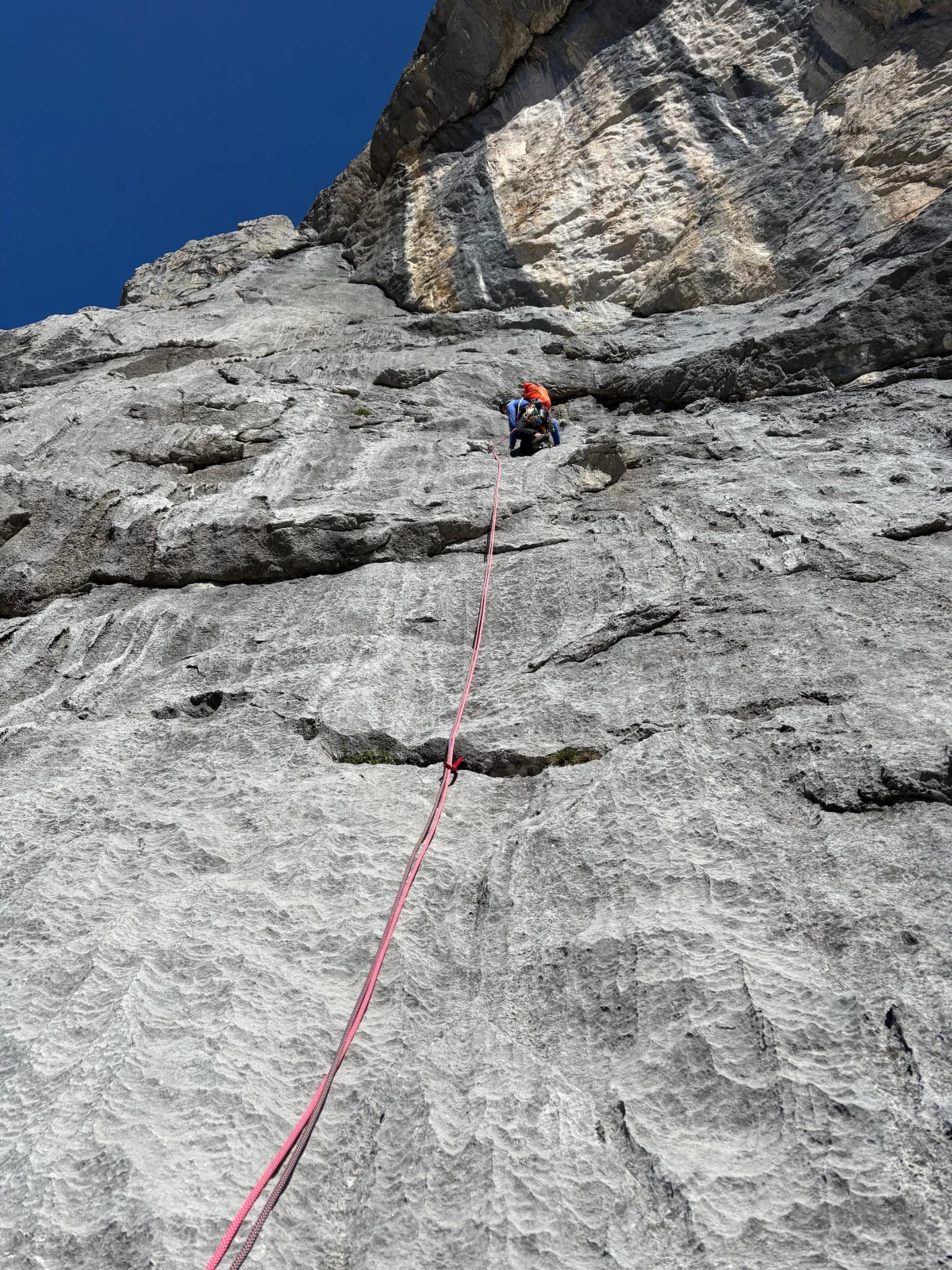 Freispitz South Face – Schreck Heel: Climber above a grey rock slab.