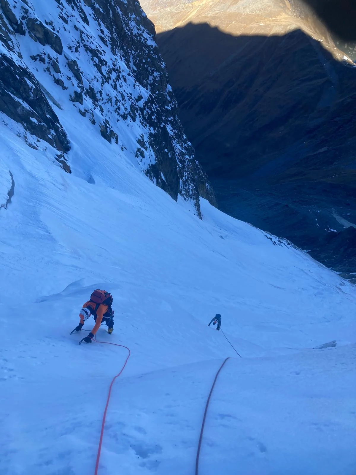 Hochferner North Face with a Mountain Guide: Roped climbers ascending a steep snow gully.