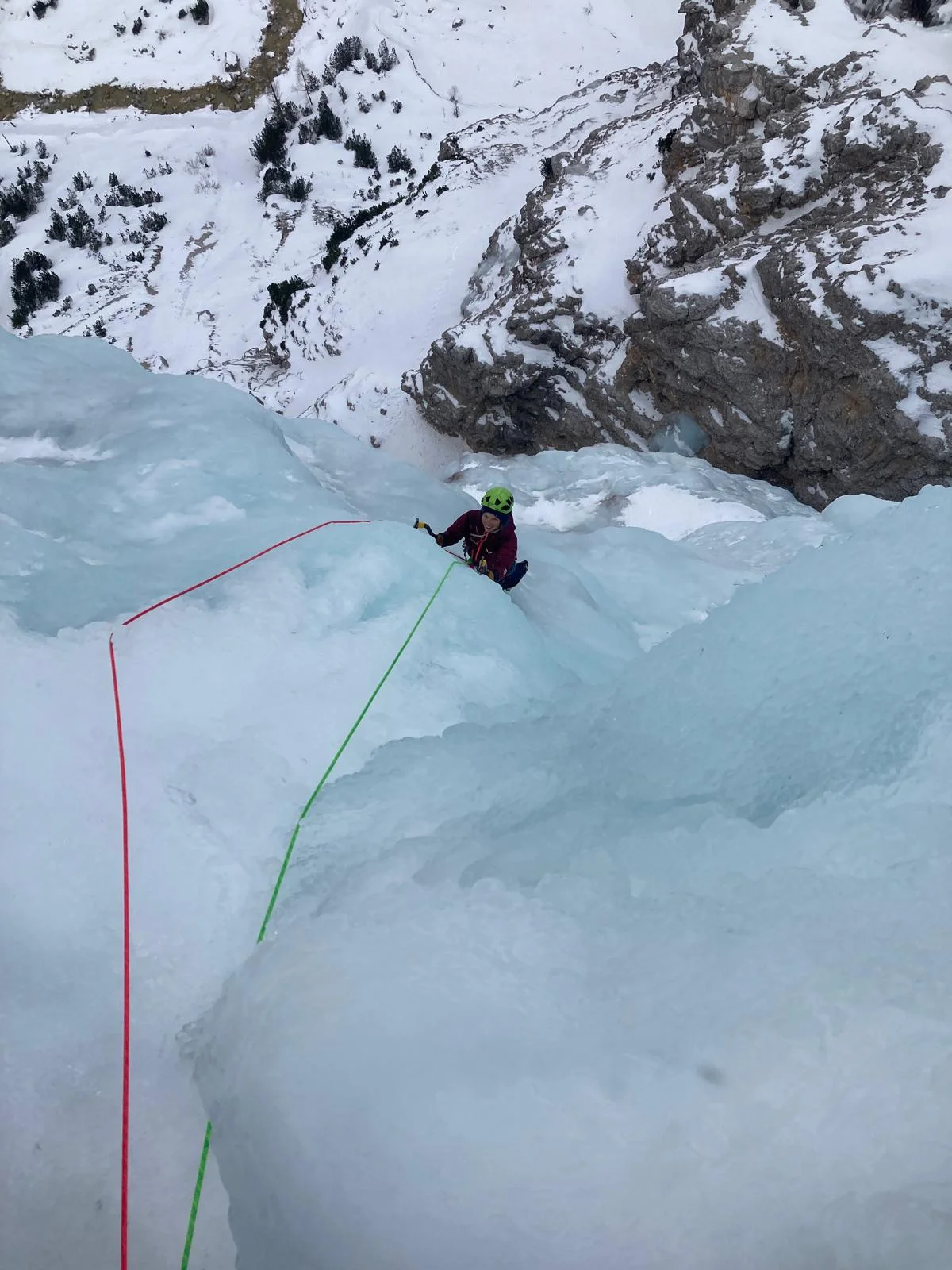 Canadian Dream – Ice Climbing in the Dolomites: Roped ice climber above an ice step.