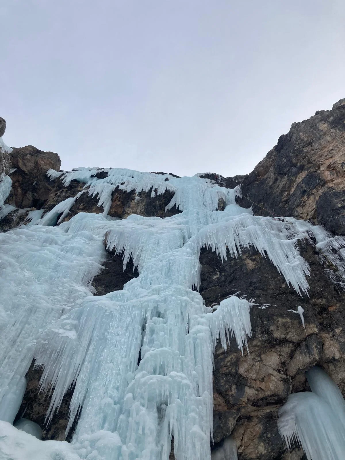 Canadian Dream – Ice Climbing in the Dolomites: Long frozen waterfalls on a rock wall.