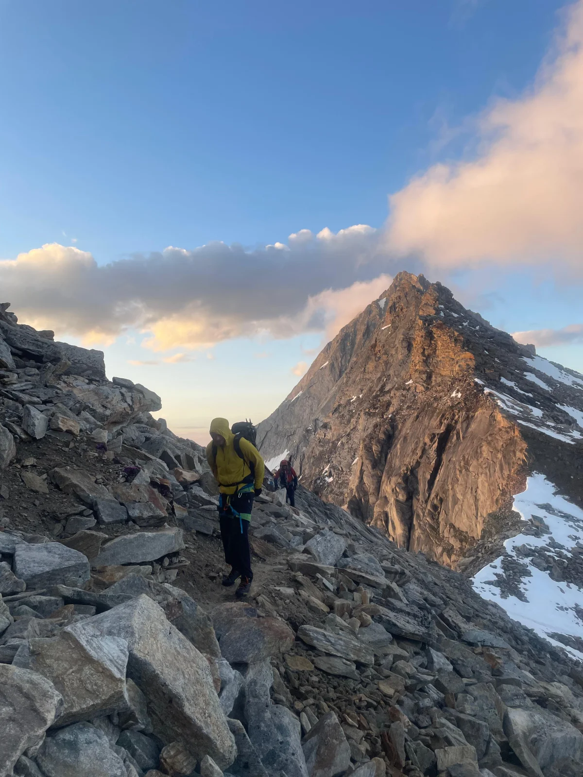 Easy 4,000-Meter Peaks in Saas-Fee: Mountaineer ascending a rocky ridge.