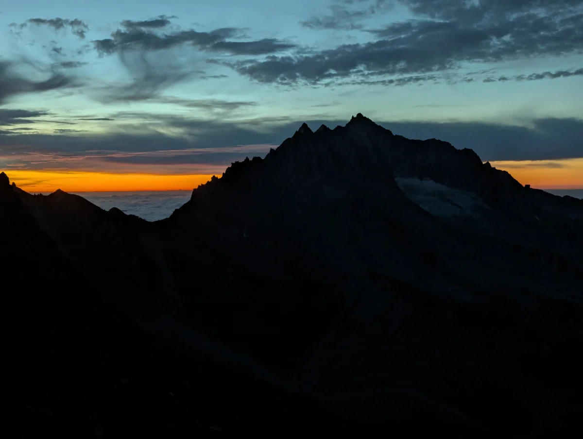 Easy 4,000-Meter Peaks in Saas-Fee: Silhouette of a mountain peak in evening light.