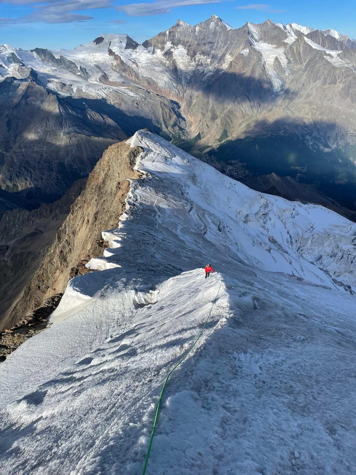 Easy 4,000-Meter Peaks in Saas-Fee: Roped climbers on a narrow snow ridge.