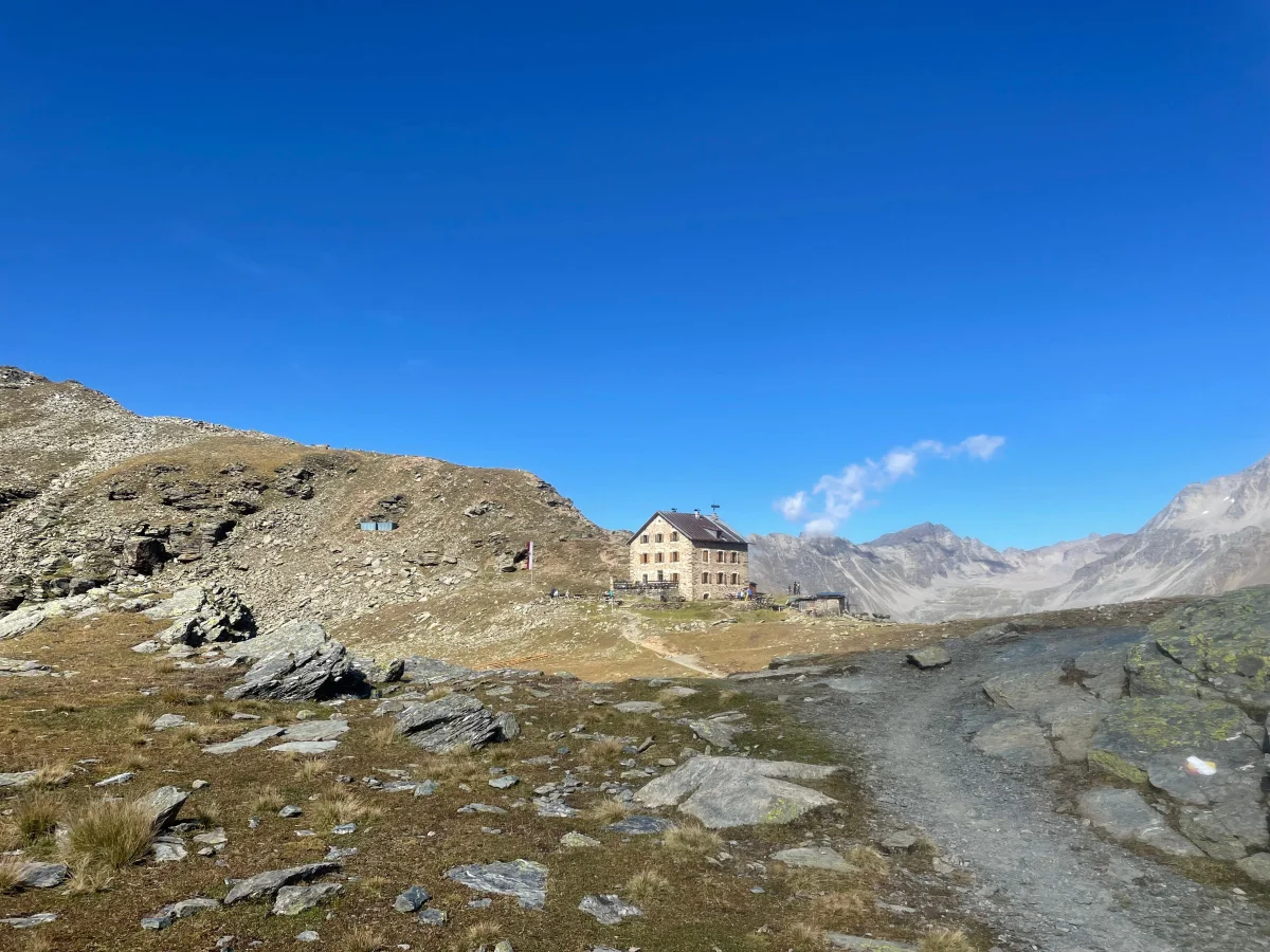 Ortler Hintergrat with a Mountain Guide: Mountain hut in a rocky alpine landscape.