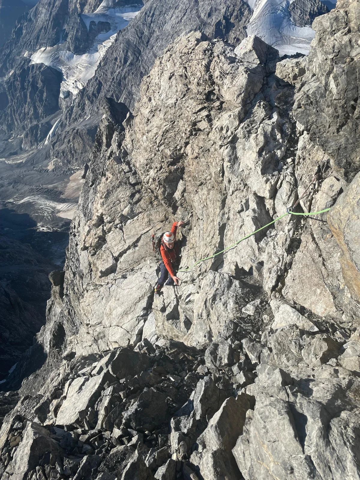 Ortler Hintergrat with a Mountain Guide: Roped climber on a steep rocky ridge.