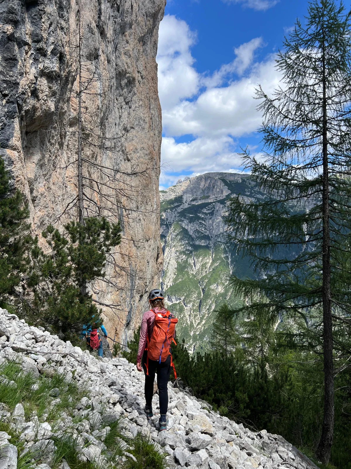 Palfrader on the Geierwand in Toblach – Steep Alpine Climb in the Dolomites: Mountaineer approaching beneath a rock wall.