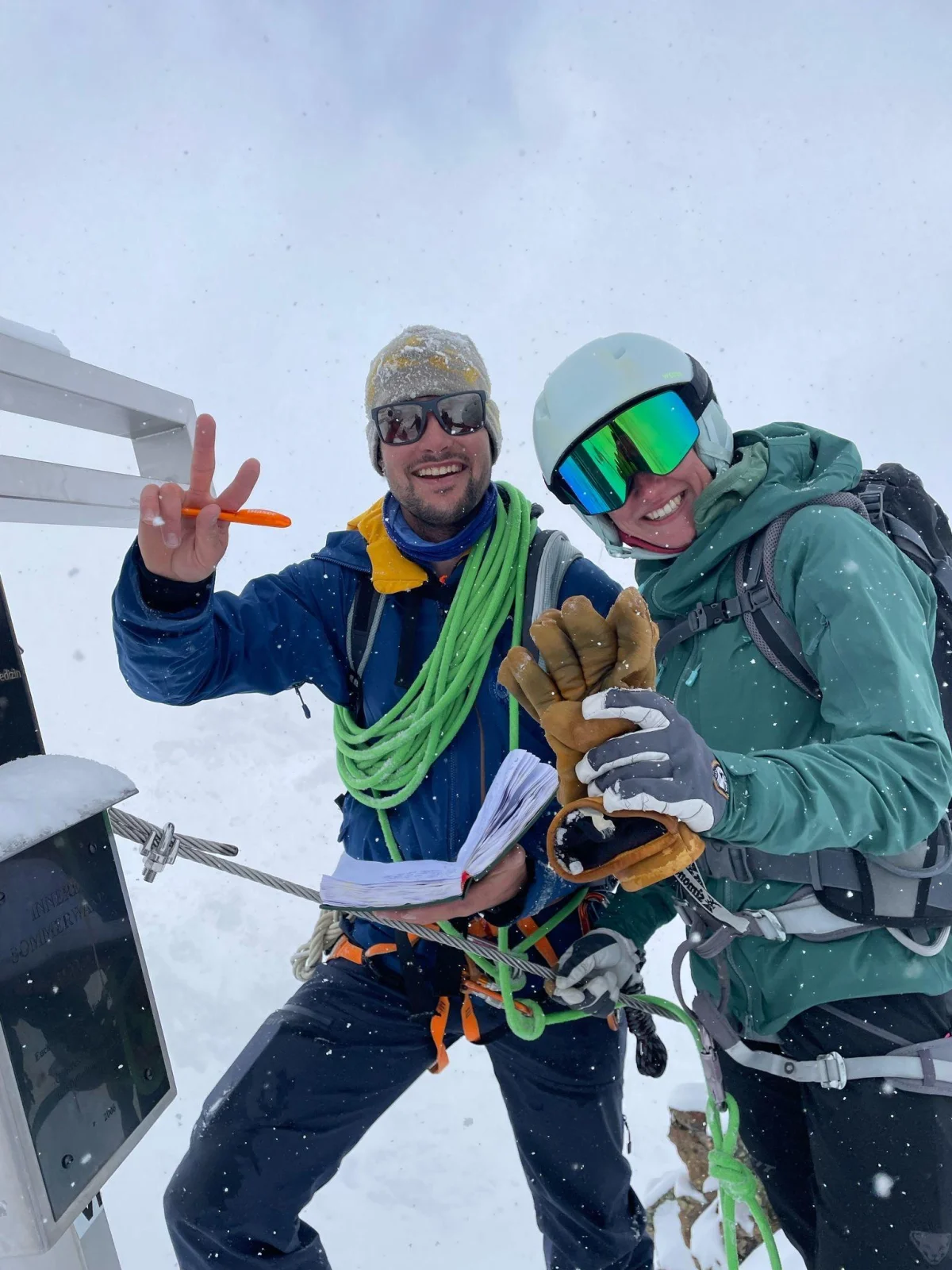 Ski Mountaineering on the Franz Senn Hut: Two smiling mountaineers with rope, helmet and ski goggles.