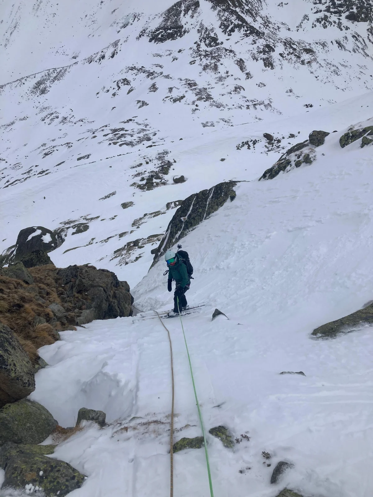 Ski Mountaineering on the Franz Senn Hut: Ski tourer ascending a narrow snow gully.