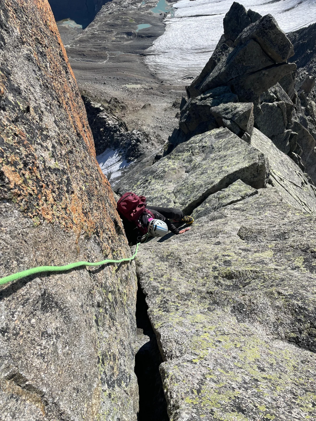 Wilde Leck East Ridge: Roped climber in a steep granite crack.