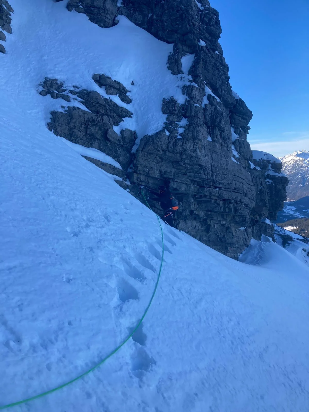 Winter Mountaineering on Thaneller: Ascent tracks beside a snow-covered rock tower.